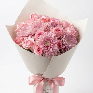 Pink rose and mauve chrysanthemum bouquet wrapped in cream paper with pink satin ribbon — Irus Floral Design